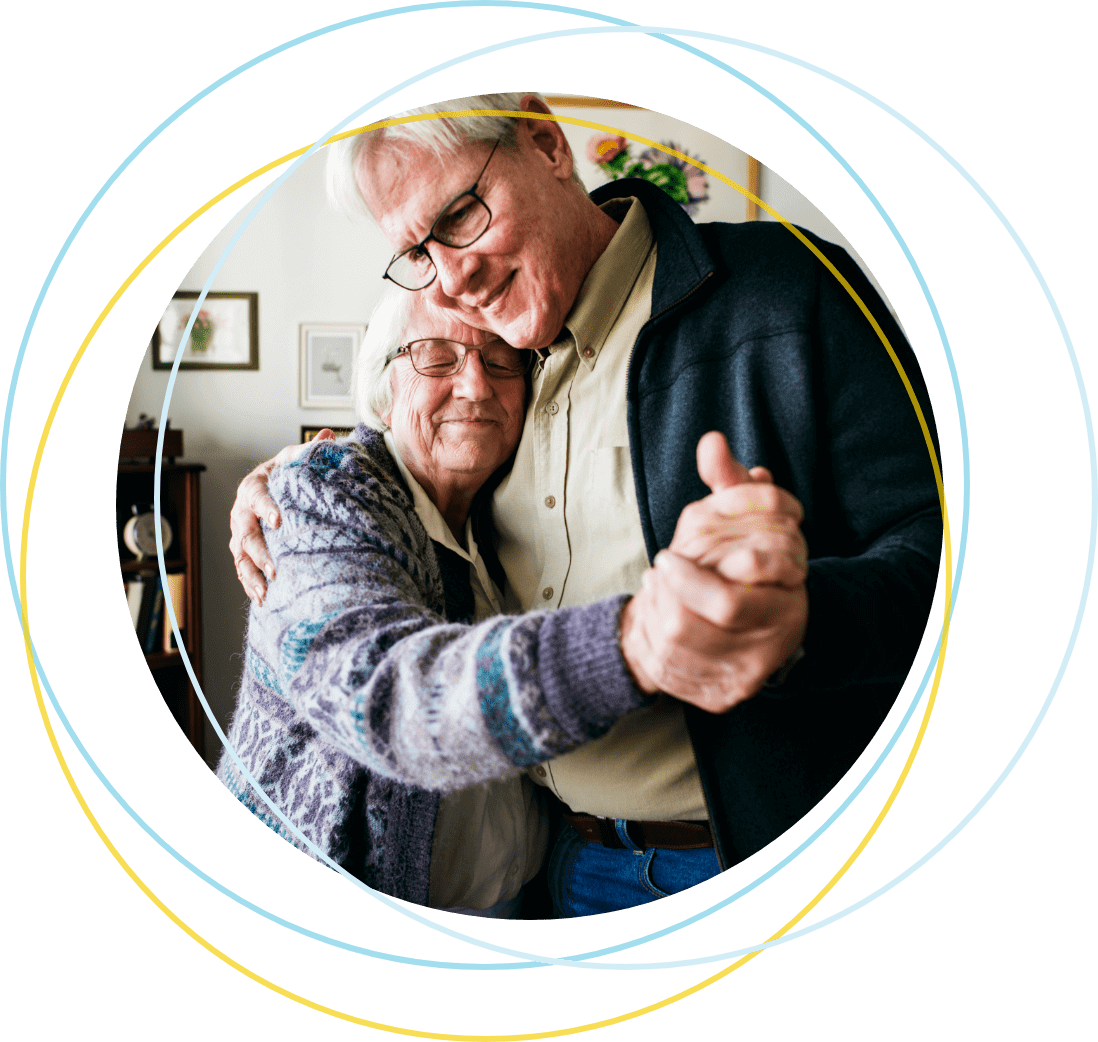 Picture of older man embracing elderly woman